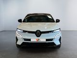 the front view of a white car in a showroom