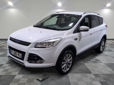 the white ford kuga suv is parked in the garage