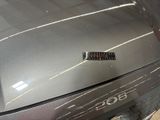 a close up of a car ' s emblem on the hood