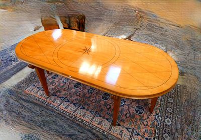 a wooden table with a circular design on top of it