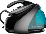 the black and blue steam iron is sitting on a white surface