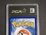 the card is in a clear plastic case with a pokemon logo on it
