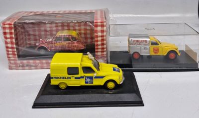 a yellow truck and a yellow car in a display case