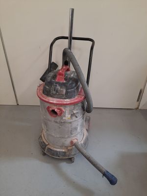 a vacuum that is sitting on the floor in the room