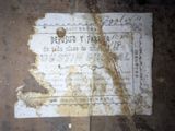 a piece of paper that has been left on the floor