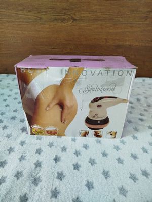 packaging of a breasty device sitting on a bed with a star pattern