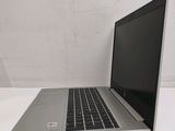 an open laptop computer sitting on top of a white table