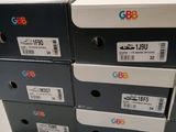 three boxes of different sizes and colors are stacked on top of each other