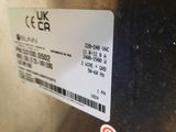 a label on the back of a stainless steel refrigerator