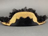 an image of a black and gold hat with a mustache on it