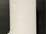 an image of a white water heater sitting on top of a counter
