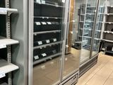 many empty shelves in a store with empty shelves