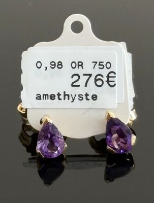 une paire de boucles d'oreilles en améthyste avec une étiquette de prix