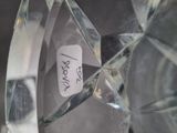 a glass vase that has a sticker on it