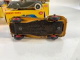 two toy cars that are sitting on a table