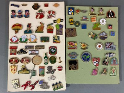 many different pins and magnets on a table