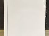 an image of a white refrigerator in a room