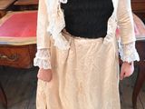 a woman that is standing in front of a table