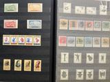 many different stamps on display in a display case