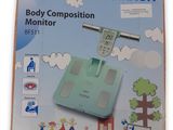 a box with a digital body composition monitor on it