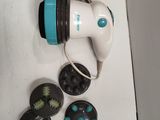 an image of a white and blue hair dryer on a table