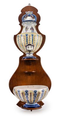 a large vase on a wooden stand on a white background