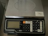 a calculator sitting on top of a metal table