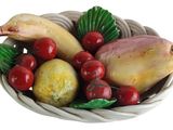 a bowl of fruit that is sitting on a table