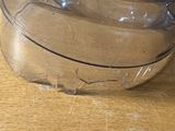a pair of shoes that are wrapped in plastic on a table