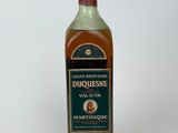 an image of a bottle of liquor sitting on top of a white surface