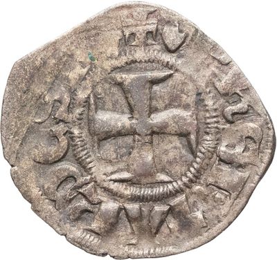 gros plan d'une pièce de monnaie sur laquelle figure un navire