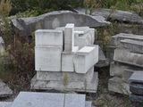 a pile of cement blocks sitting on the ground
