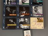 many cd ' s on the wall of a room
