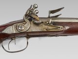 a close up of a gun on a white background
