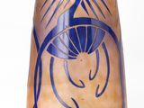 a blue vase with a design on it on a white background