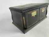 an antique black and gold painted chest with two drawers