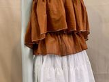 an image of a mannequin wearing a brown and white dress
