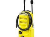 a yellow pressurer on a white background with a hose