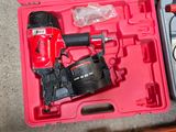 a red tool box with tools in it on the floor