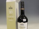 a bottle of wine sitting next to a box of wine