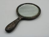 a small magnifying mirror sitting on a table
