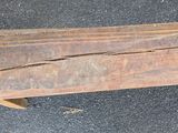 a piece of wood that is sitting on the ground