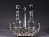 pair of silver plated glass decanters and a candle holder