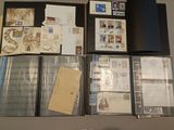 many different types of stamps and envelopes laid out on a table