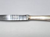 a knife that is sitting on a table