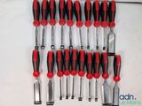 a lot of tools that are hanging on the wall
