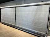 a large sliding glass door in the middle of a room