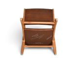 the chair is made of wood and has a brown leather seat