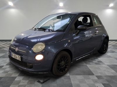 a picture of a small blue car parked in a garage