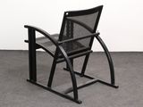 an image of a chair that is on a concrete floor